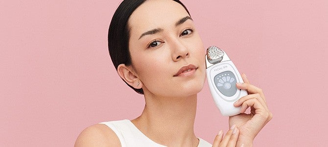 nu skin device article - facial spa - In-Article Image woman holding nu skin facial spa skin care device